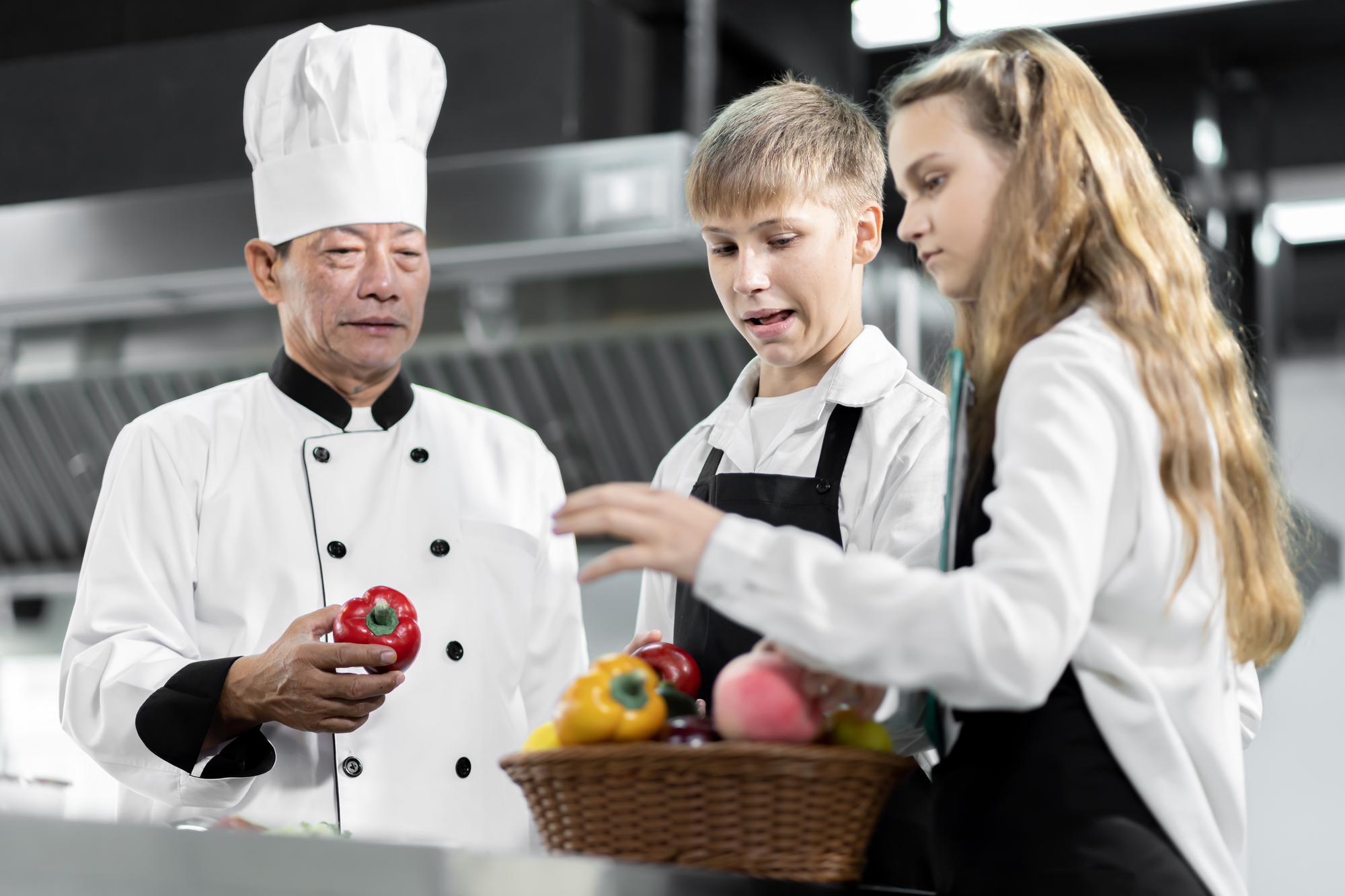 Students are learning to cook in a culinary institute with a sta